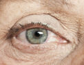 Elderly woman close up photo of eye